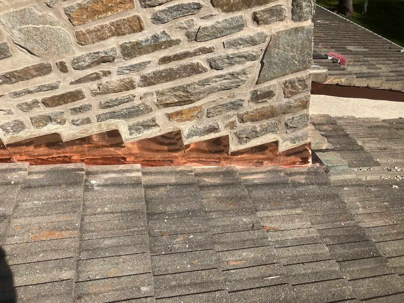 Custom copper chimney flashing on a slate roof