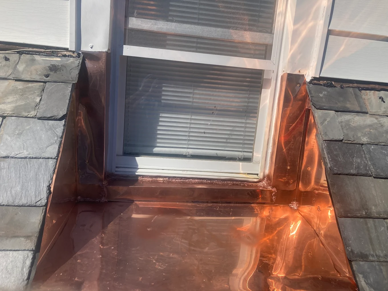 Hand-soldered copper dormer flashing